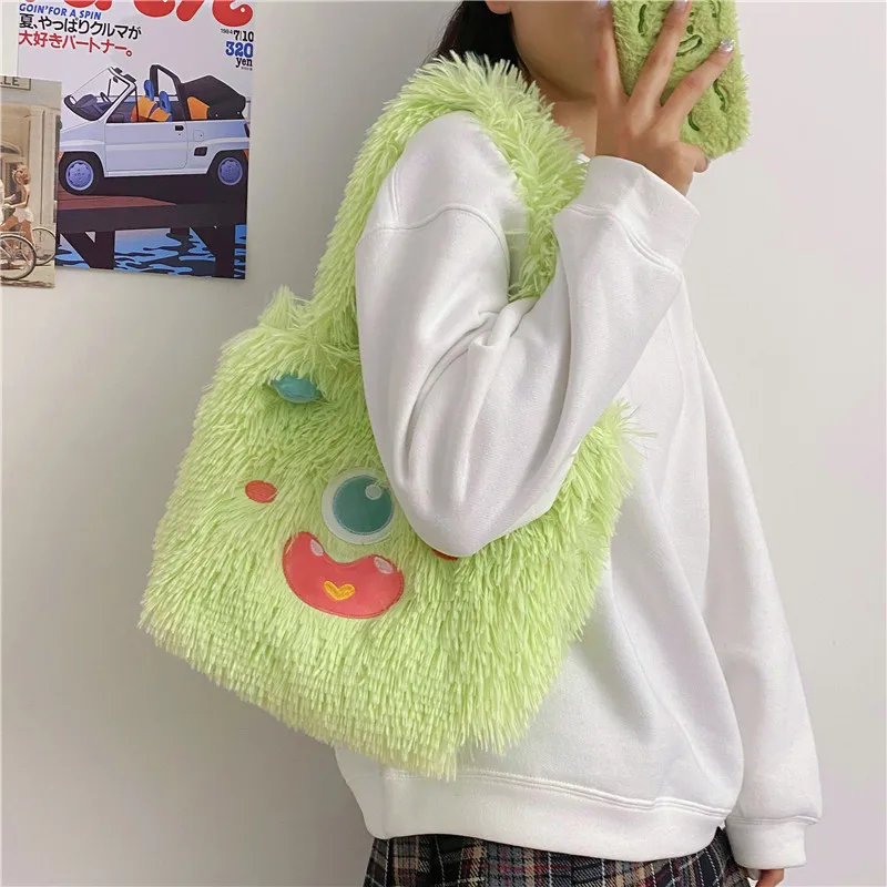 Women Cute cartoon little monster plush shoulder bag ins new large capacity Tote bag girl