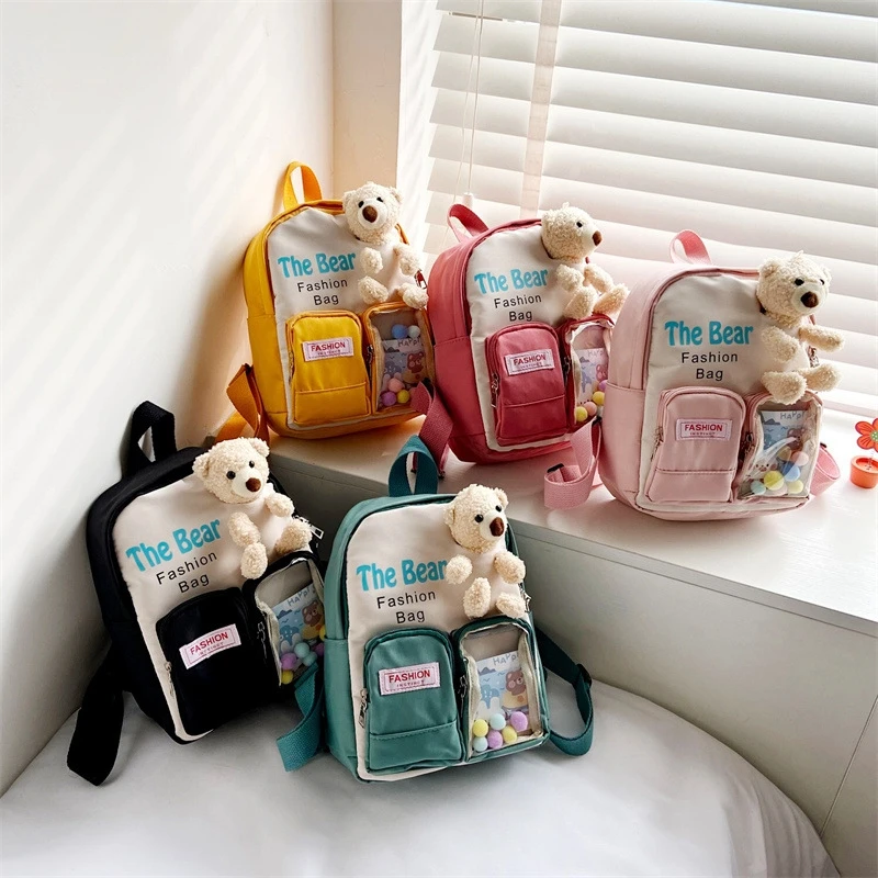 

Children Backpack Letter Printed Primary School Bag With Little Bear Doll Teenage Multi Pockets Student Toddler Mochila