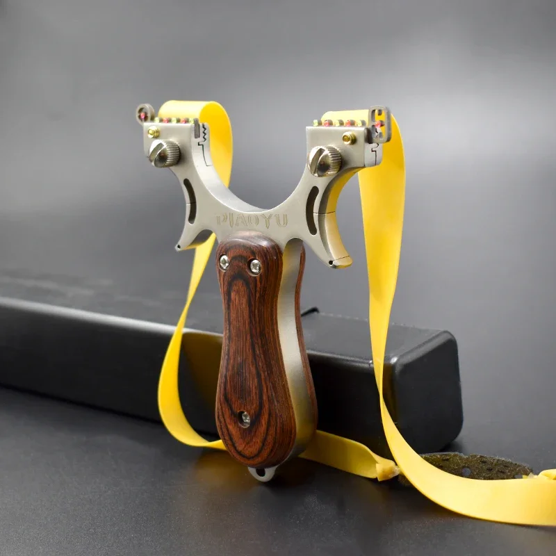 

High Quality Wooden Patch Stainless Steel Metal Slingshot Wild Hunting Outdoor Shooting Slingshot Toy With Rubber Band