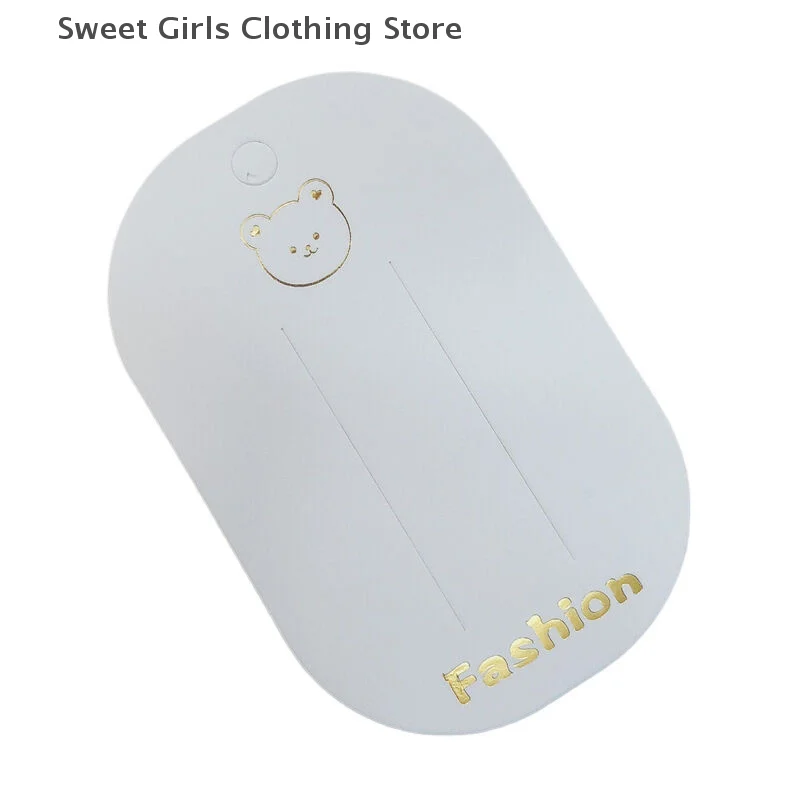 Karta ekspozycyjna akcesoriów do włosów do projektów DIY - zestaw 50 spinek do włosów z motywem małego misia.