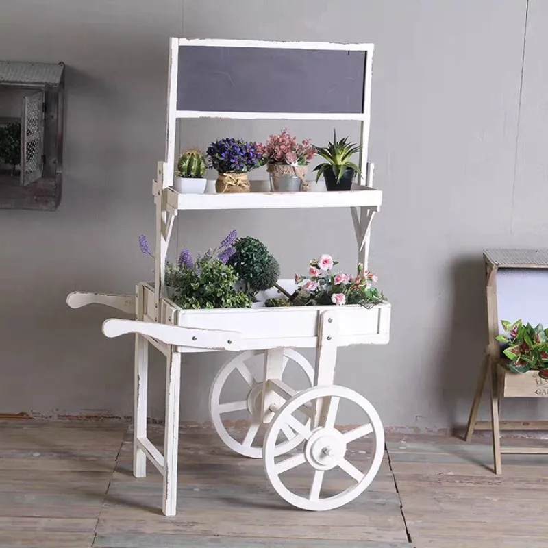 

Old wood, floor-to-ceiling ornaments, soft ornaments, fresh blackboard flower stands in the window, with wheels