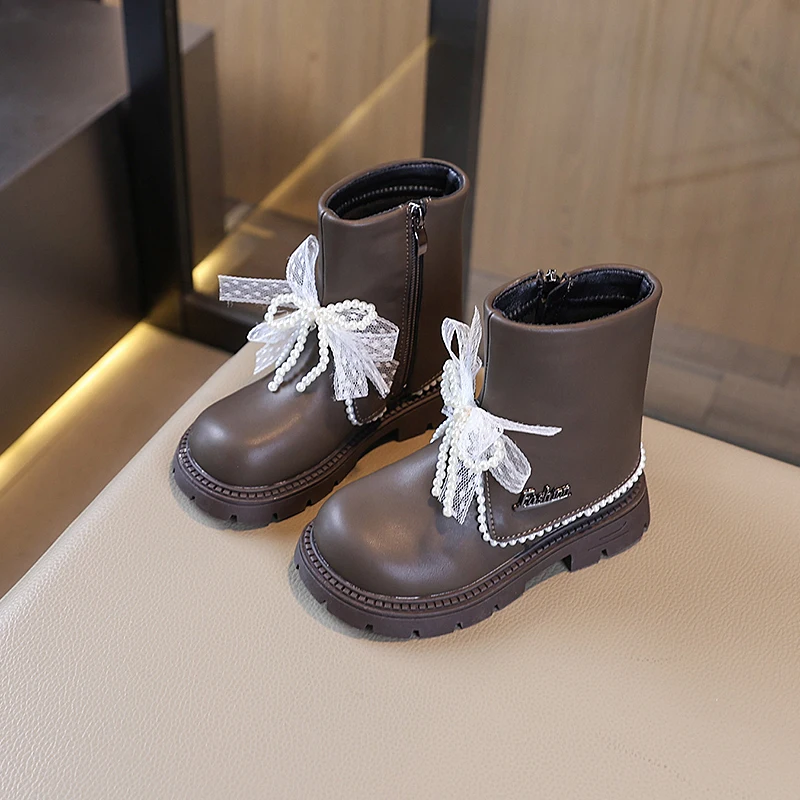 2025 nouvelles filles bottes doublées en peluche mode arcs perles conception enfants chaussures d'hiver haut antidérapant luxe enfants botte en cuir