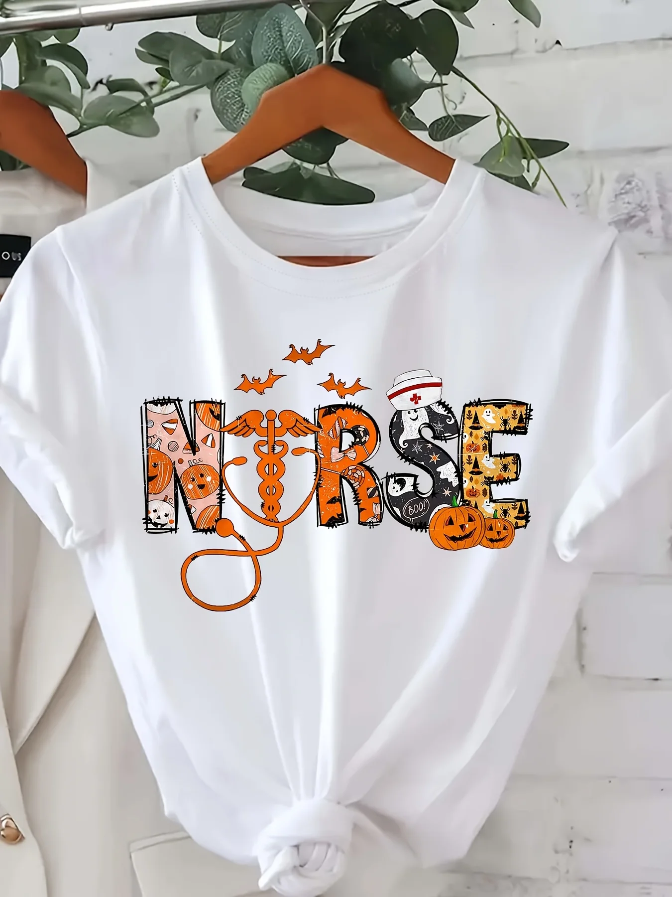 

Women's Halloween Nurse Graphic T-Shirt - Black Short Sleeve Crew Neck Casual with Spooky Motifs Bats Pumpkins Print