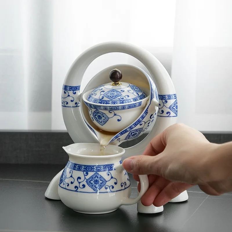 Creative Ceramic Clear Flower Rotating Lazy Man Tea Making Tool Cradle style Tea Pot Semi automatic Portable Travel Tea Set