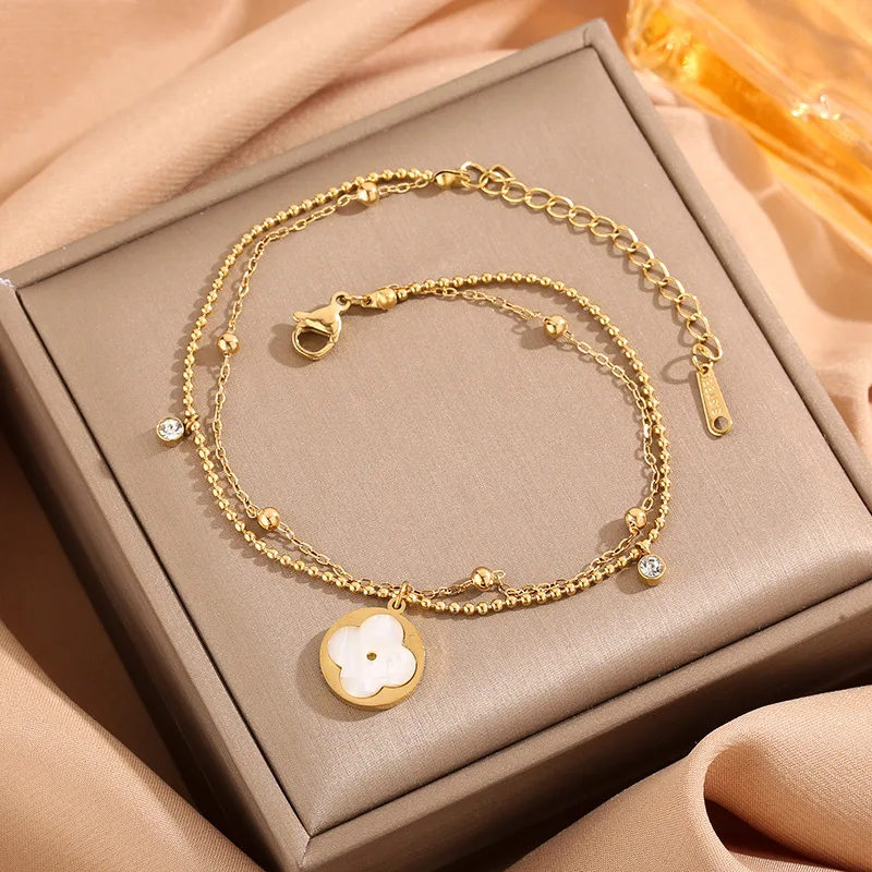 

Новая цепочка-браслет на ногу из Южной Кореи с четырехлистным цветком, цирконами, двухслойными круглыми бусинами, с покрытием из 18-каратного золота и розового золота.