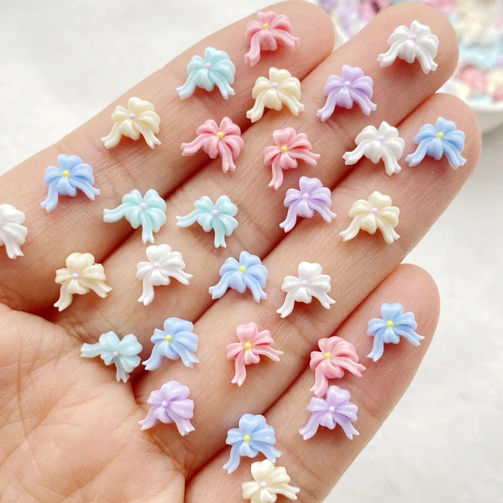 100 ชิ้นผสมสีสันโบว์ริบบิ้นเล็บแบน Rhinestone ลูกปัดสมุดภาพ DIY เล็บ Appliques อุปกรณ์เสริมหัตถกรรม