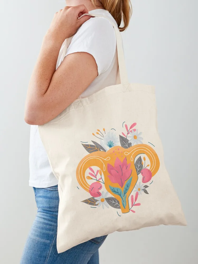 

Uterus with floral decoration cartoon female symbol Tote Bag reusable shopping bag Canvas Handbags women