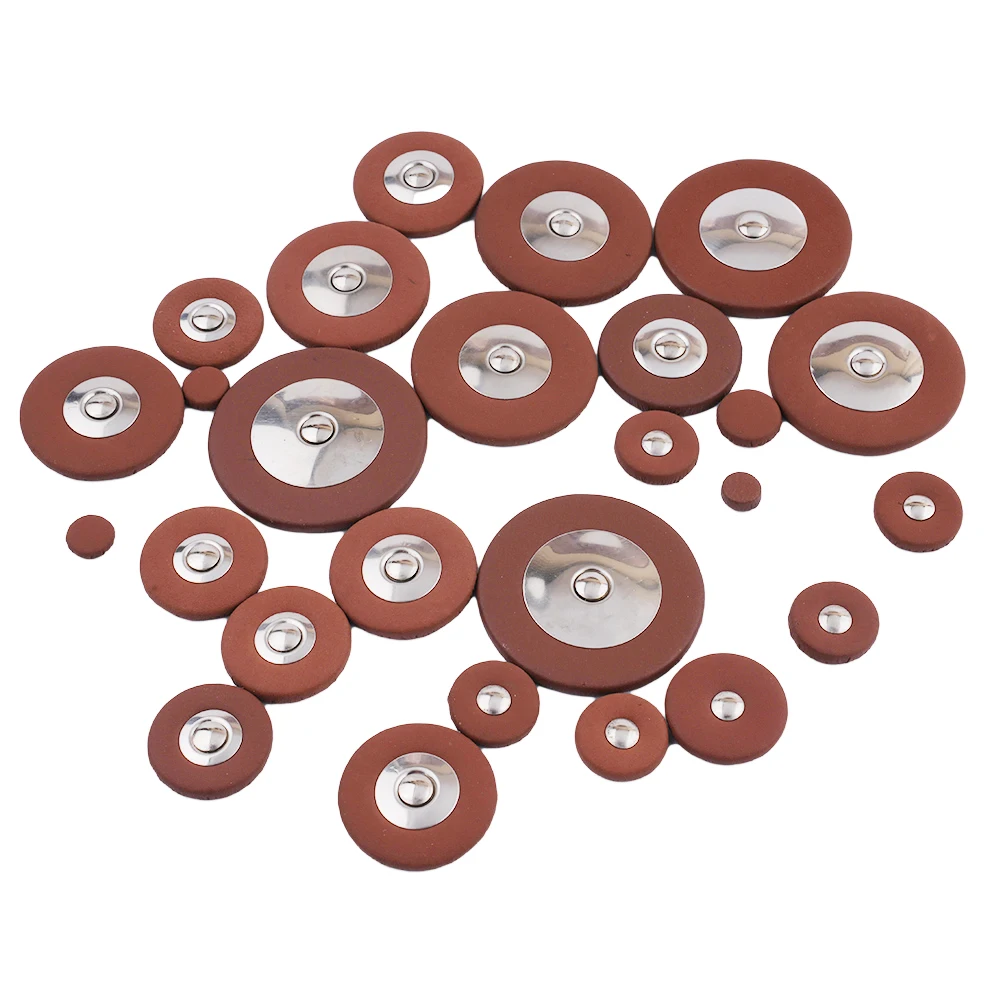 Replacement pads kit for alto and tenor saxophones including multiple sizes for key protection and maintenance