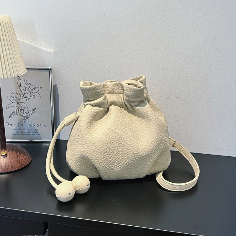 

Mini Drawstring Bucket Bag, Soft Faux Leather Crossbody Purse with Ball Tassel, Casual Small Shoulder Bag with Detachable Strap