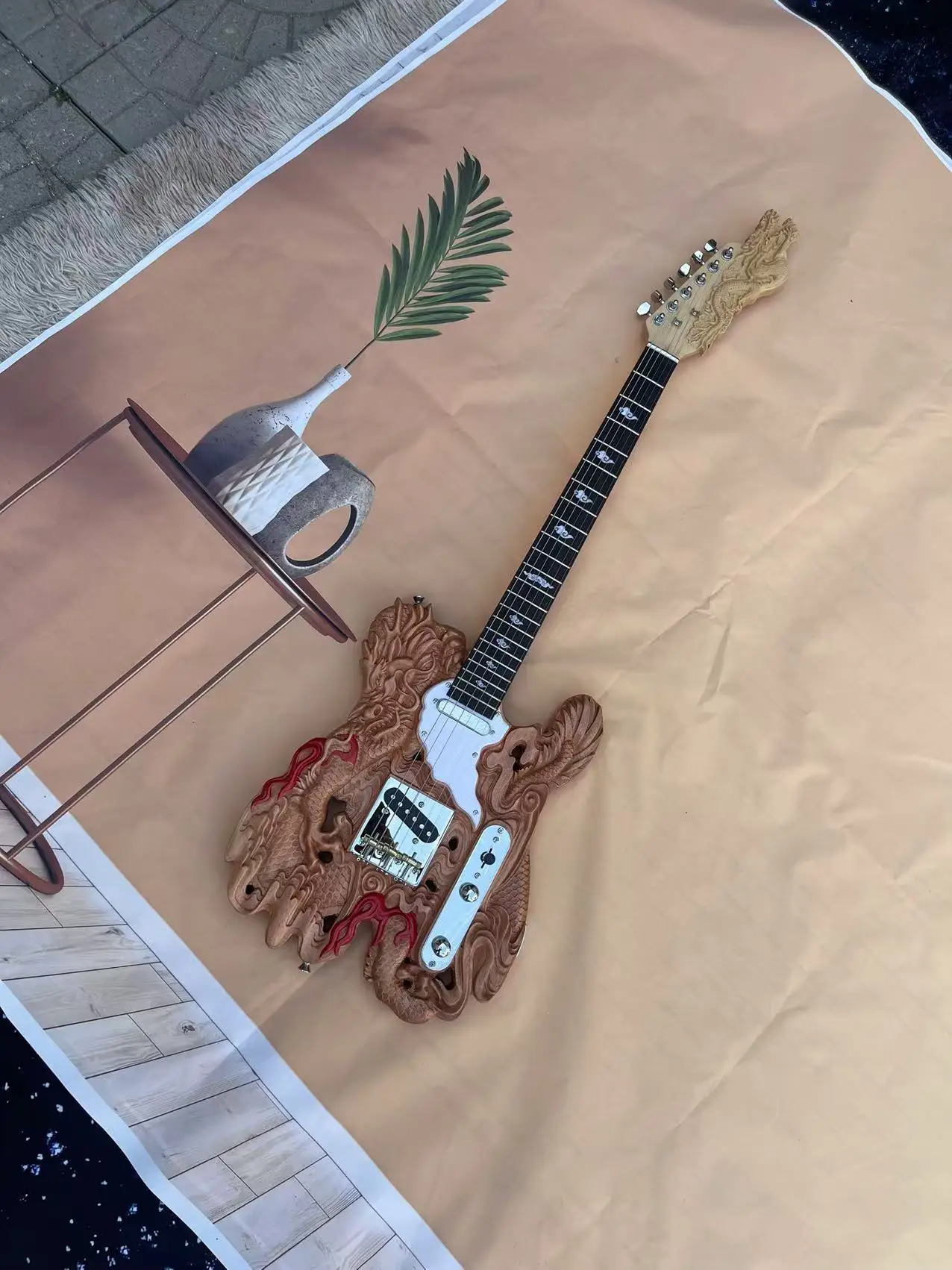 In stock, 6-chord dragon shaped carved electric guitar, with a natural wood color body and real shipping pictures. Order and shi