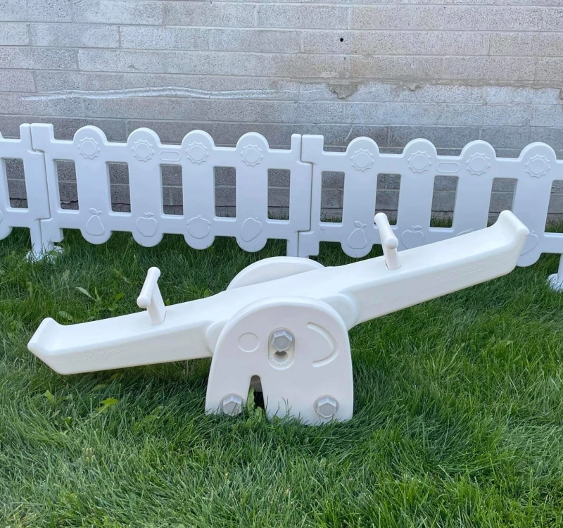 

white plastic seesaw party rental balance beam