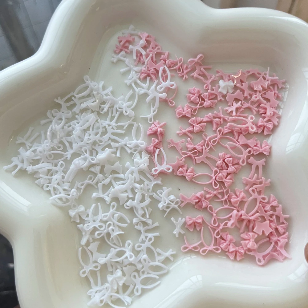 ﻿ 100 قطعة القوس الشريط الوردي مسمار الديكور ثلاثية الأبعاد الراتنج Kawaii الدانتيل Bowknot التعادل مسمار الملحقات الأبيض/الأزرق الحلو مانيكير السحر أجزاء