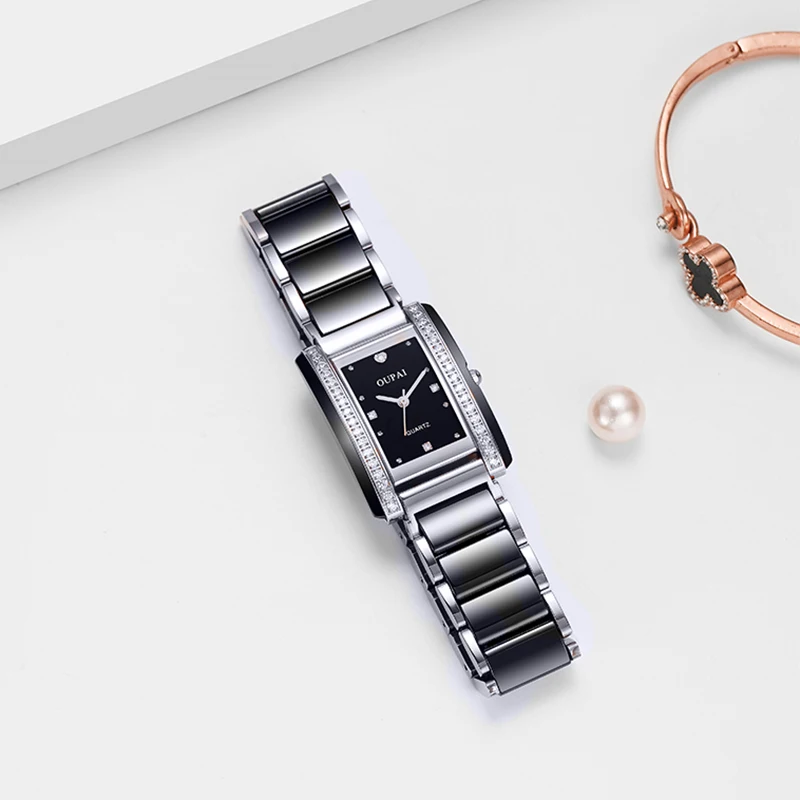 ساعة Oupai مستطيلة للنساء سوار أسود من حجر الراين كوارتز حركة عصرية وبسيطة ساعة يد رائعة مقاومة للماء