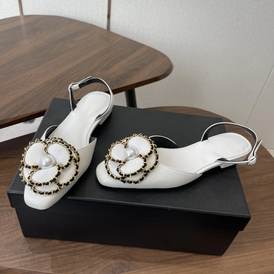 Women's Pearl-Embellished Flats side profile demonstrating 1cm stacked leather sole and chain drape across instep