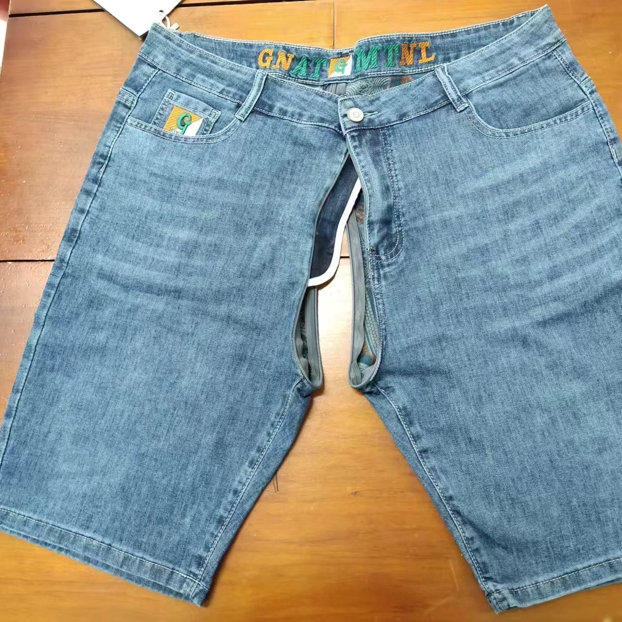 Pantaloncini di jeans da uomo Pantaloni aperti con cerniera invisibile Pantaloni estivi sottili di fascia alta elastici larghi con stampa dritta Pantaloni medi a cinque punti sottili