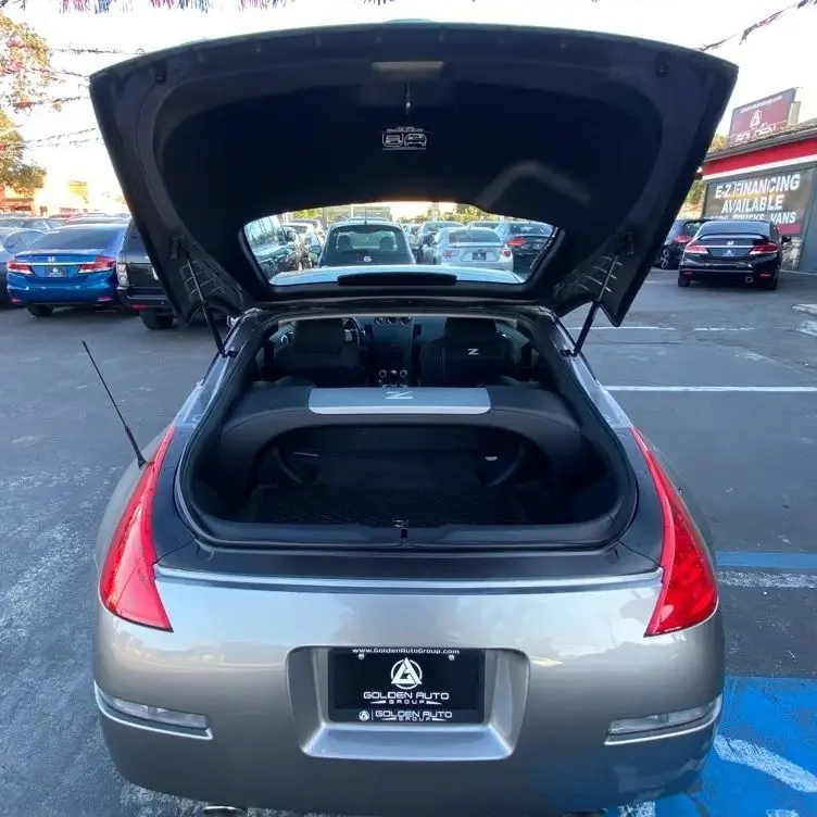 

Автоматические стойки с пружинами для Nissan 350Z 35 2005, купе без спойлера, задняя дверь багажника, подъемник багажника, поддерживает амортизатор, стержень