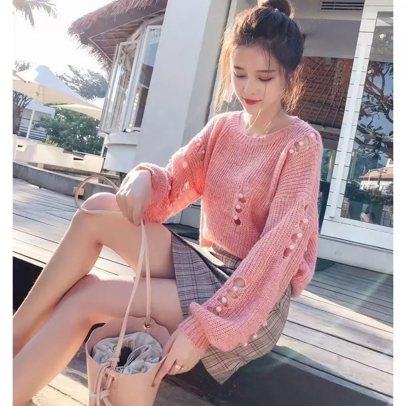

The New Design The Knitted Hollowed-out Loose Sweater Is Laid-back Stylish and Comfortable It Is A Knitted Sweater Top and Smock