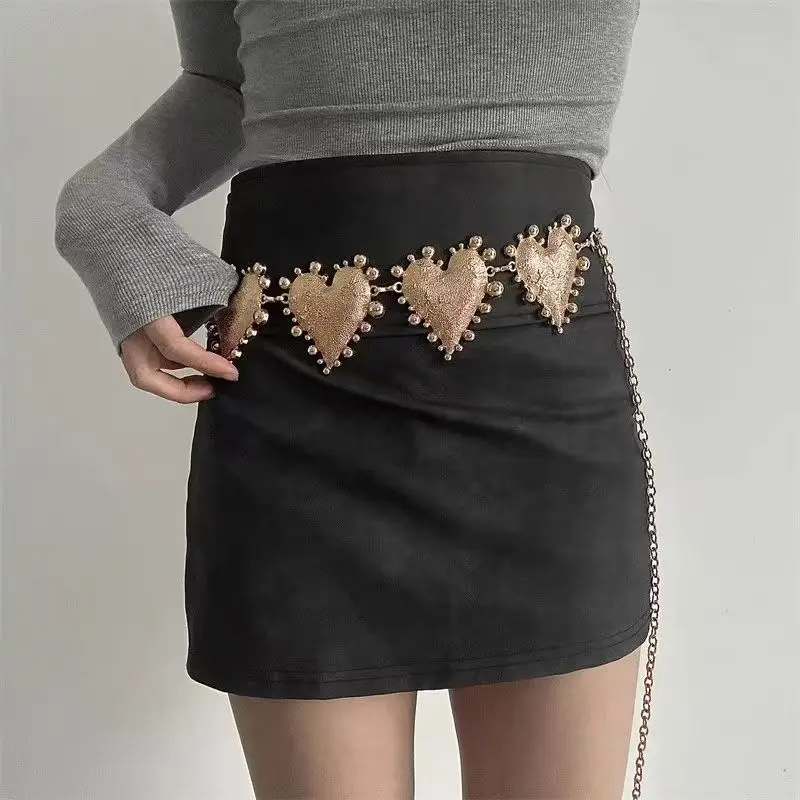 A high-end women's waist chain — a bold metal belt featuring an oversized heart design, adding a unique and stylish touch