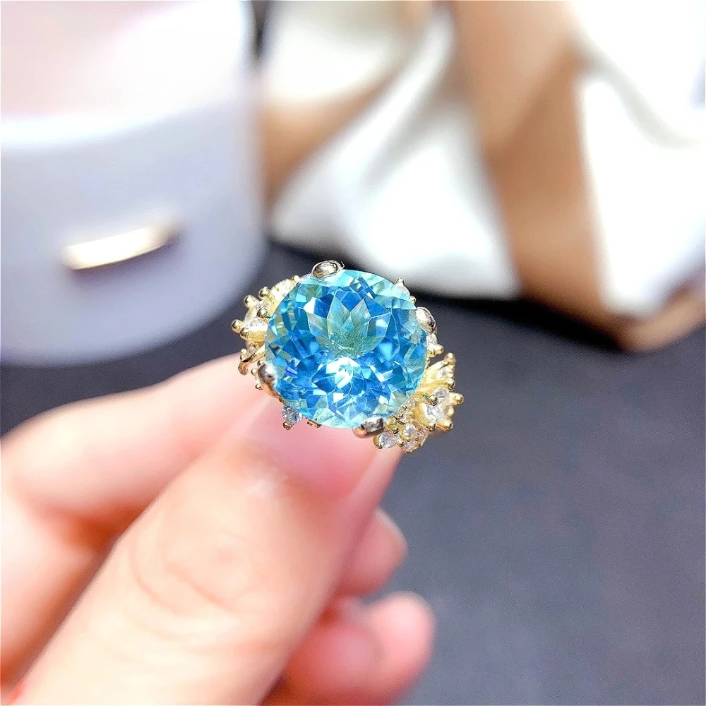 Exquisite 925 sterling silver ring set with sky blue sapphires and colorful gemstones. Simple design for ladies.