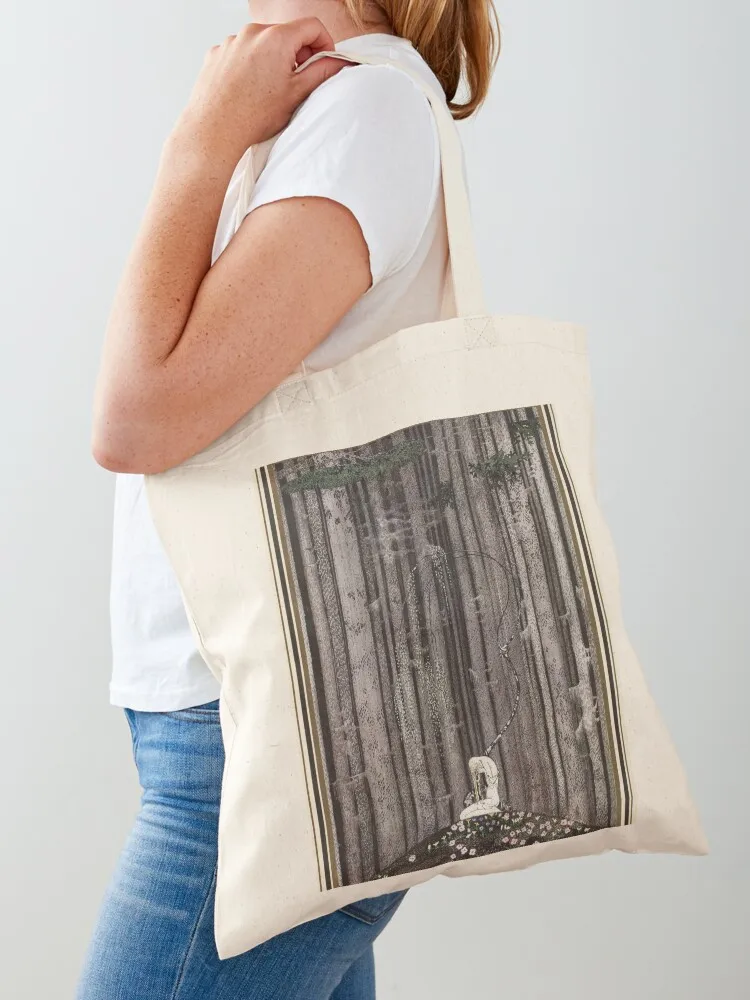 

‘And then she lay on a little green patch in the midst of the gloomy thick wood’ Illustration by Kay Nielsen in East o Tote Bag