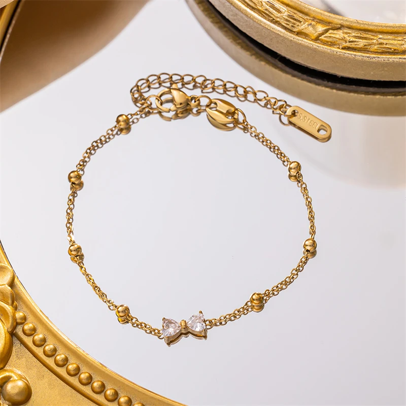 316L الفولاذ المقاوم للصدأ مجوهرات الأزياء الجديدة الفتيات الصغيرات على شكل قلب الزركون Bowknot سلسلة سحرية قلادة سوار القرط للنساء