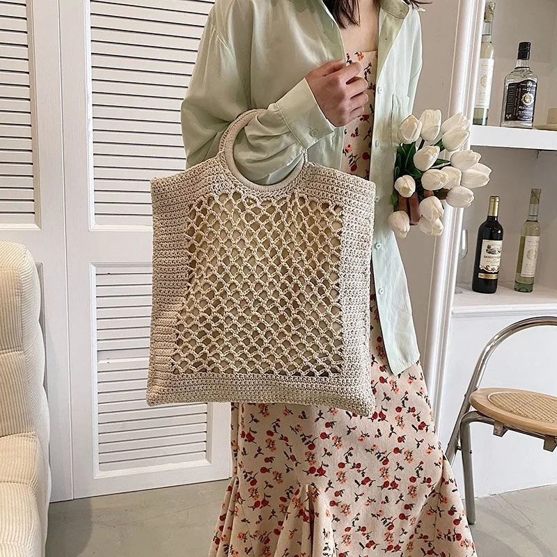 

Hand-woven Literary Artistic Forest Top-Handle Bags Women's New Large-capacity Holiday Style Hollow Straw Woven Beach Bags