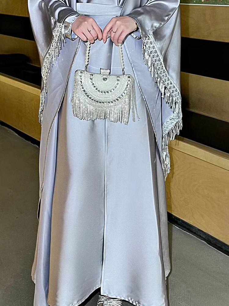 

Осенняя новая женская одежда с круглым вырезом, модные кардиганы и платья с рукавами «летучая мышь» и кисточками по подолу, элегантные женские однотонные наряды для поездок на работу