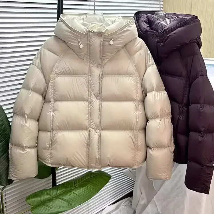 Abrigo de invierno para mujer, nueva chaqueta de algodón cálida y gruesa con capucha corta abombada de Color puro, estilo pan suelto, prendas de vestir exteriores de manga larga