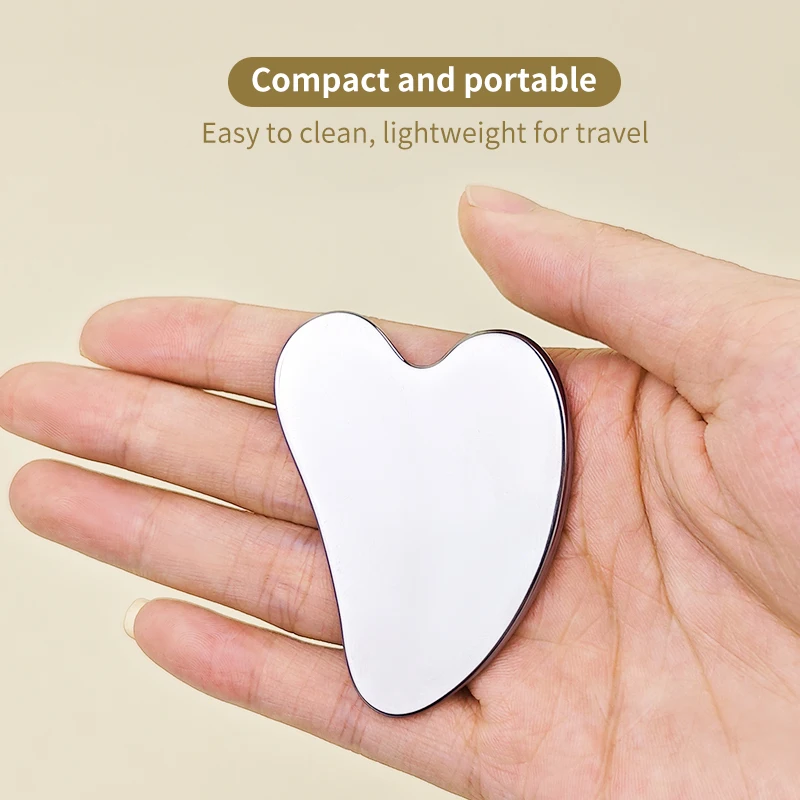 เครื่องขูดรองพื้นใบหน้าสแตนเลสรูปหัวใจแบบพกพาและใช้งานได้จริง 1 ชิ้นสำหรับการล้างเครื่องสำอาง