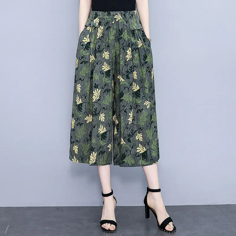 高齢者の女性の夏の新綿シルクフラワーパンツ女性の 7 分ワイドレッグパンツ弾性ハイウエストルーズスカートパンツ