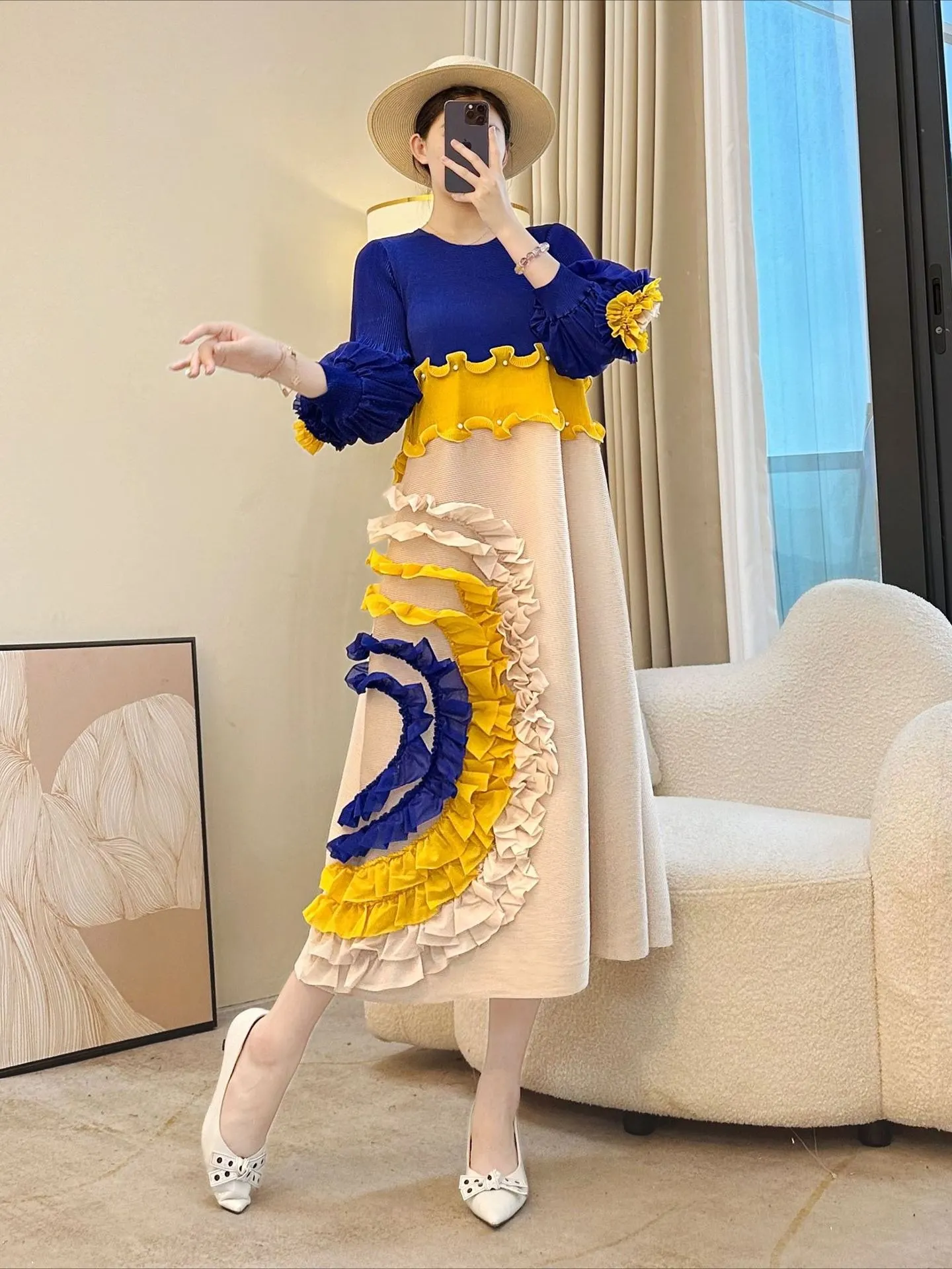 

Fold Stylish Midi Women Dress with Intricate Ruffle Detailing and Vibrant Blue-Yellow-Beige Color Blocking Pleated Dress 2025