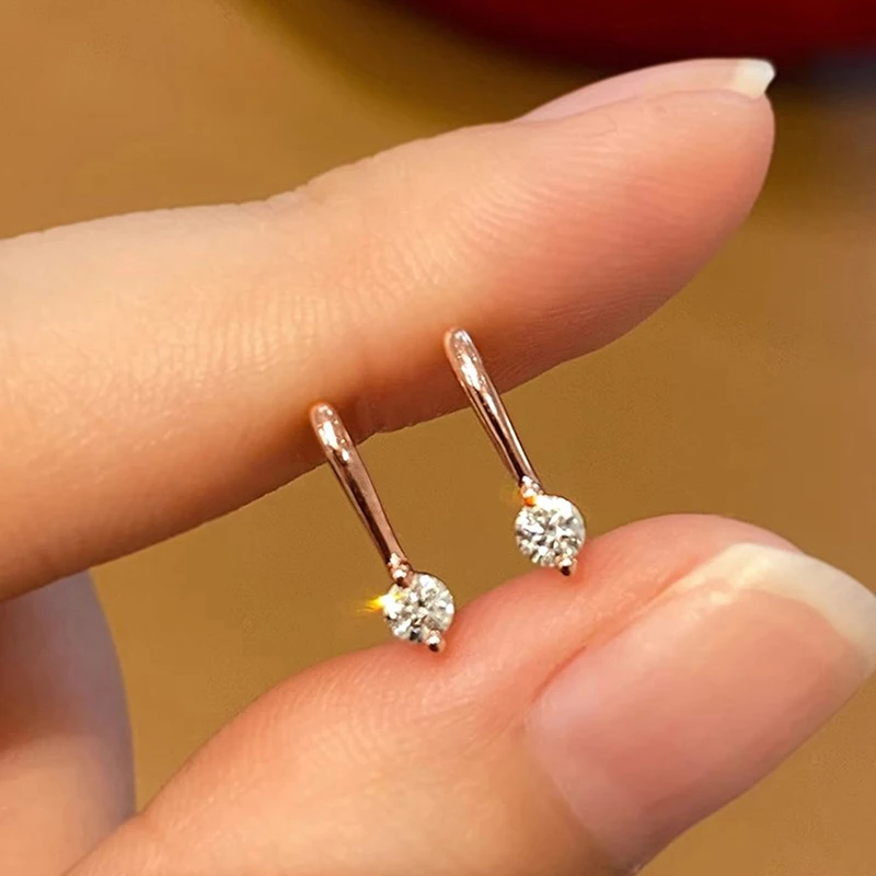 Huitan Einfache, stilvolle, durchbohrte kleine Tropfenohrringe für Frauen, schicke Roségoldfarbe, täglicher Schmuck, helle kleine Zirkonia-Accessoires
