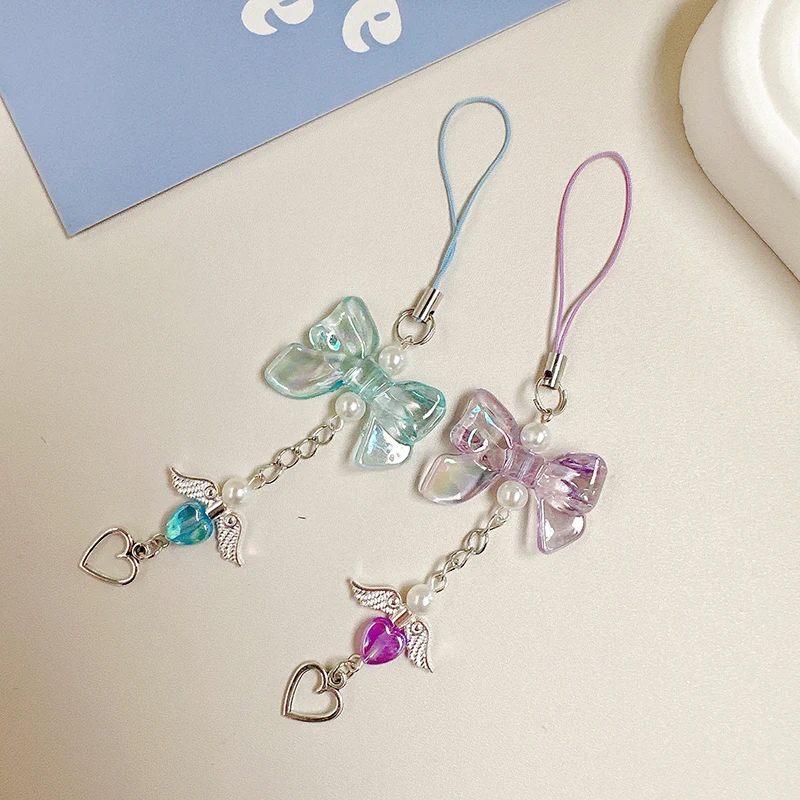 สายโซ่คล้องโทรศัพท์รูปโบว์ Y2k หวานปีกนางฟ้าน่ารักจี้รูปหัวใจเคสสายคล้องคอป้องกันการสูญหาย