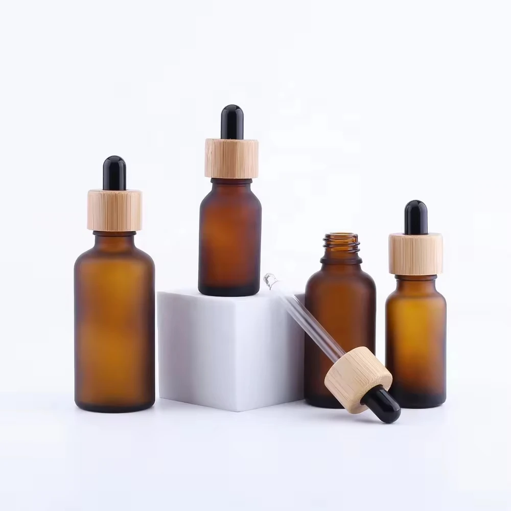 Whosesale frascos de garrafa conta-gotas de vidro âmbar/verde/azul/preto de alta qualidade com tampa de bambu pipeta para garrafas de perfumes cosméticos