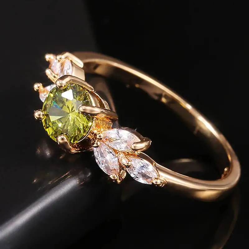 Huitan Fresh Style Damen-Ring in Goldfarbe mit eingelegtem, funkelndem, ovalem, grünem CZ-Blatt-Design, modisches Party- und Hochzeitszubehör, Schmuck