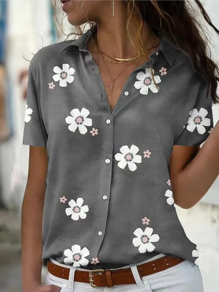 Camisa con botones cómoda e informal holgada con cuello de manga corta y estampado de flores a la moda adelgazante para primavera y verano para mujer