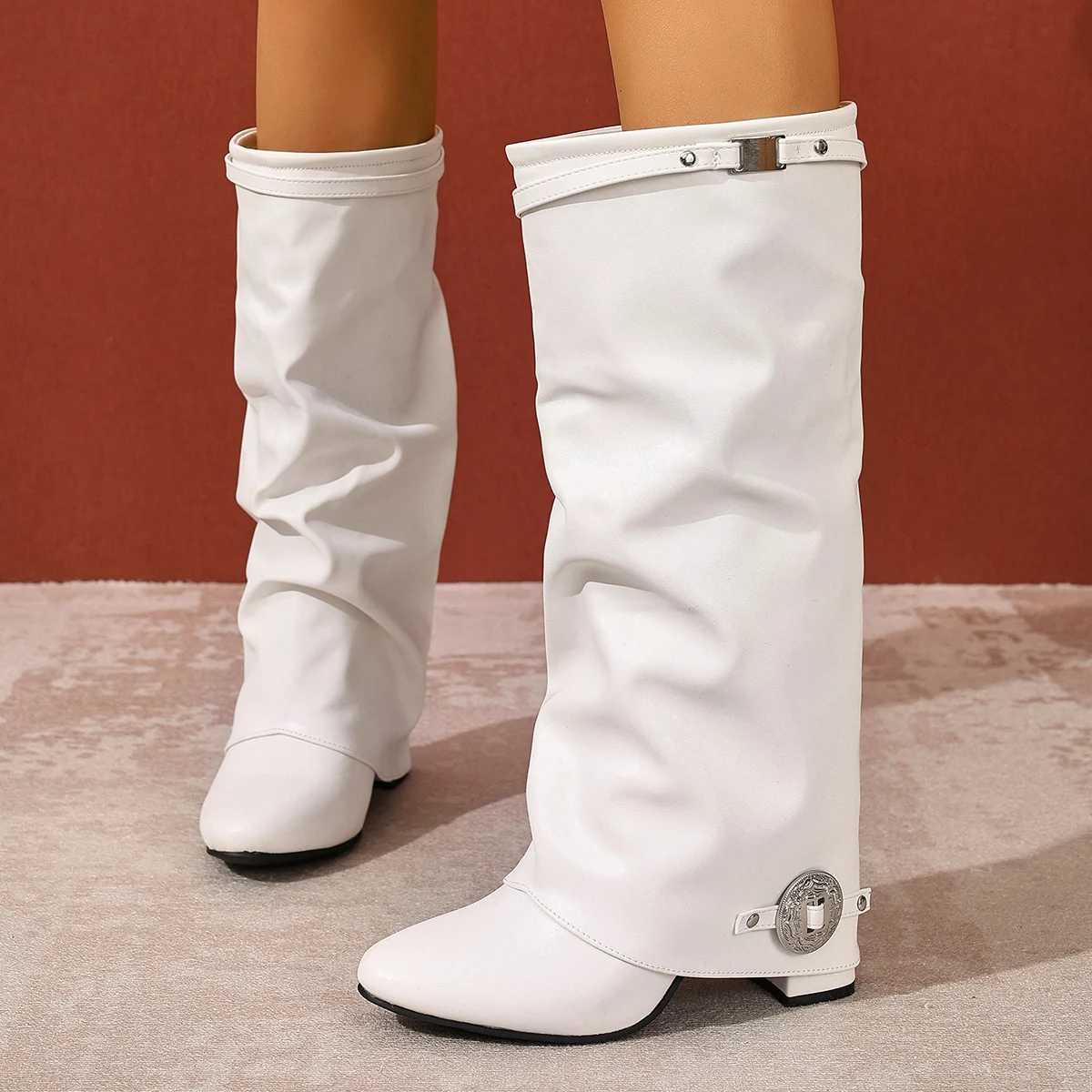 

Female mid-heeled round toe knee-high boots with silver metal buckles on the sides embellished with stylish high boots