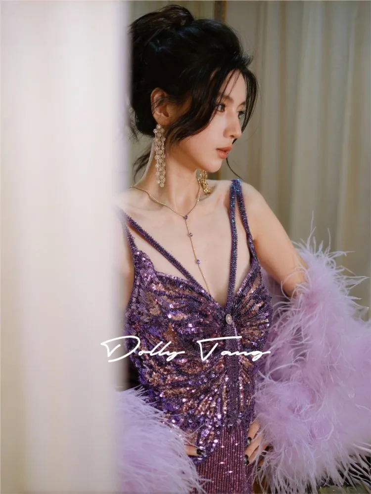This dress features an outstanding waist-to-hip ratio and a backless design with purple sequins that accentuate the buttocks