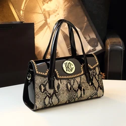 New 2023 new bright leather with middle-aged mother pillow bag high fashion high-volume hand-held messenger bag trend