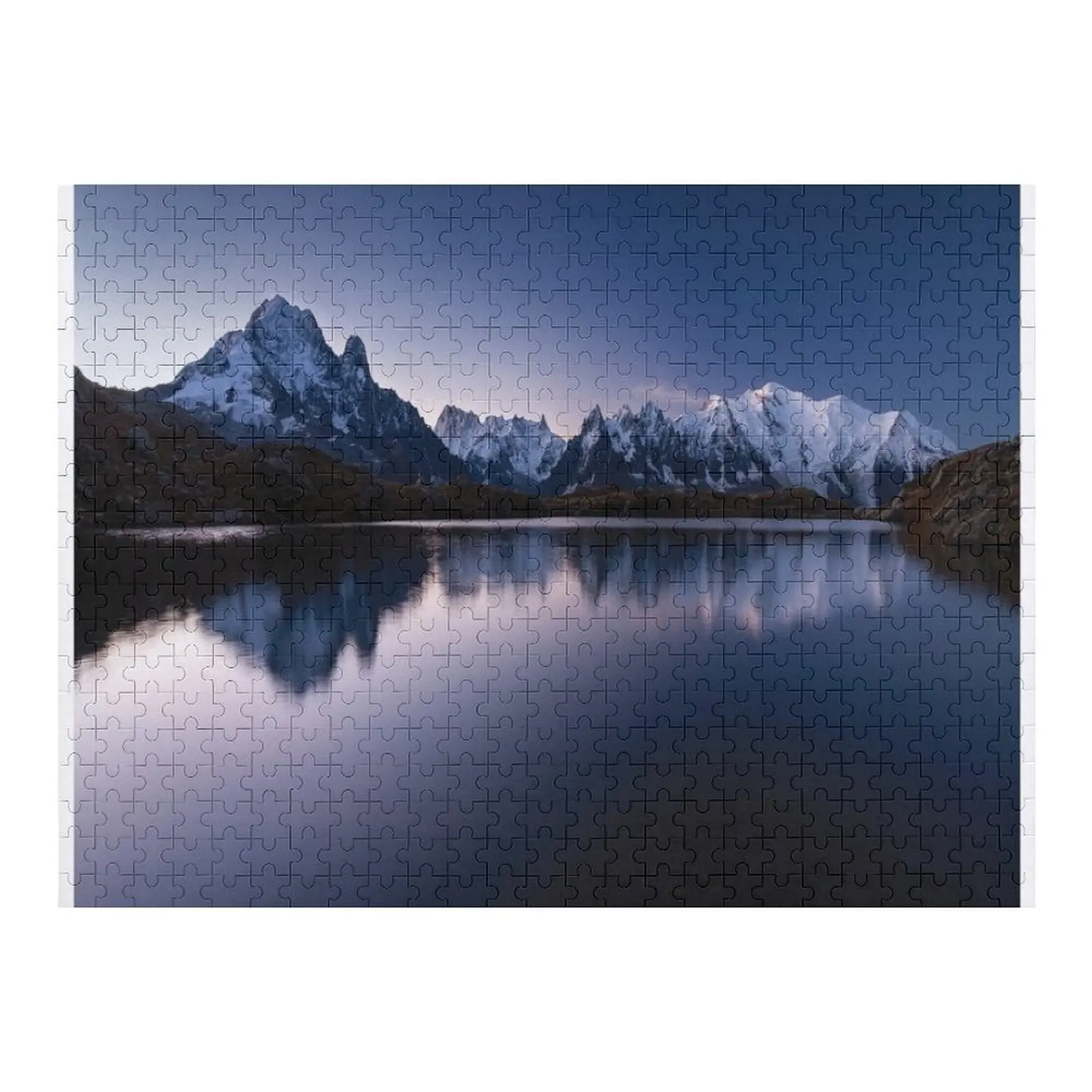 

Mount Mont Blanc covered in the snow reflecting on the water in the evening in Chamonix, France Jigsaw Puzzle