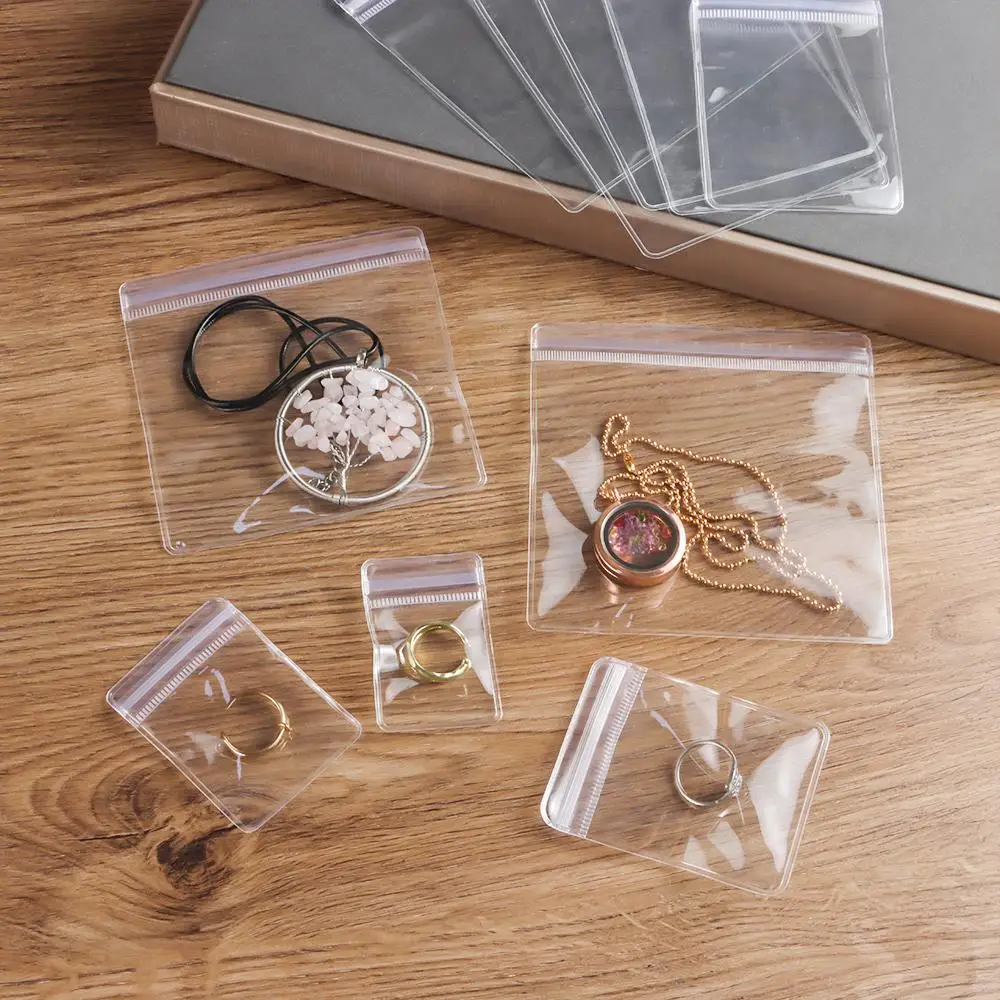 100 Stück PVC selbstdichtende Kunststoff langlebige Zip-Lock-Beutel wiederverschließbare dicke transparente Schmuckbeutel Geschenkverpackung Aufbewahrungsbeutel