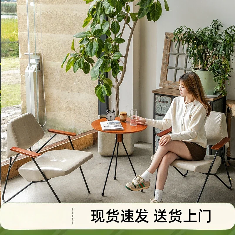 The product can be customized. High-end wrought iron, coffee shop leisure table and chair combination