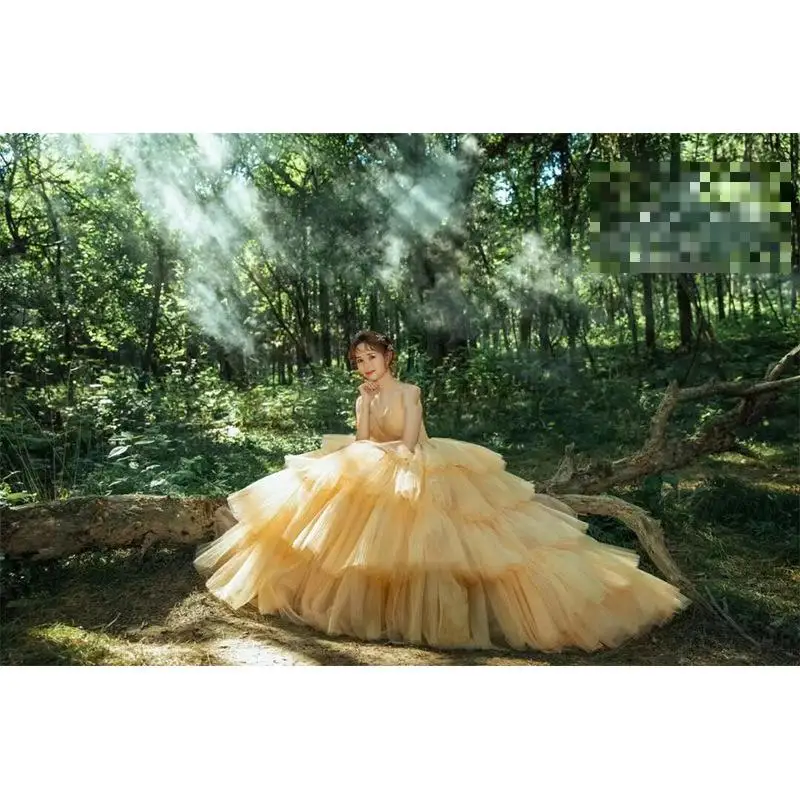 

Customized Yellow Ball Gown Wedding Dresses Sexy Strapless Tulle Bridal Dress With Small Train Fashion Tiered Robe De Mariee