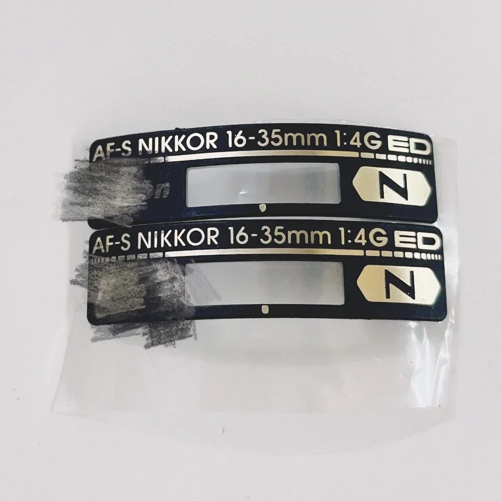 1 ชิ้นยี่ห้อใหม่สําหรับ Nikon AF-S Nikkor 16-35 มิลลิเมตร 16-35 มิลลิเมตร 1:4 G ED F4 ป้ายป้ายโลโก้ส่วนกล้อง SLR อุปกรณ์ซ่อม