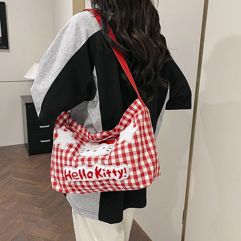 حقيبة كتف منقوشة ناعمة لطيفة من Hello Kitty للسيدات ذات سعة كبيرة وحقيبة قماش كروس للطالبات وحقيبة التنقل اليومية