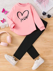 Pink heart-print round-neck top with solid color stretchy trousers, girls' fashion two-piece set for a casual and comfortable ou