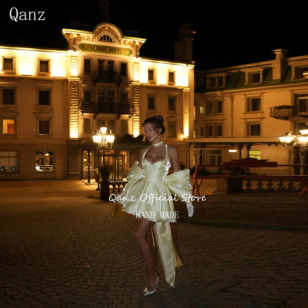 

Qanz Light Yellow Evening Gowns Shiny Satin Spaghetti Traps Short A Line Prom Dress Backless Bow Vestidos De Fiesta Customized