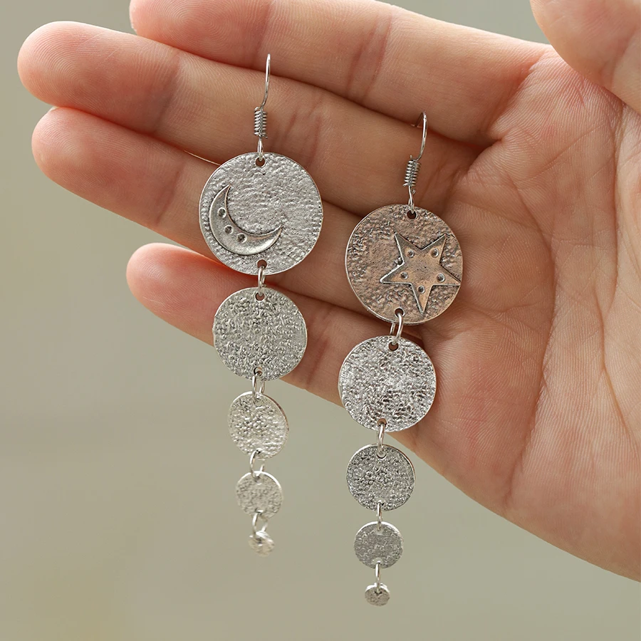 A pair of vintage Bohemian style sun and moon long earrings, asymmetrical metal round sheet handmade earrings