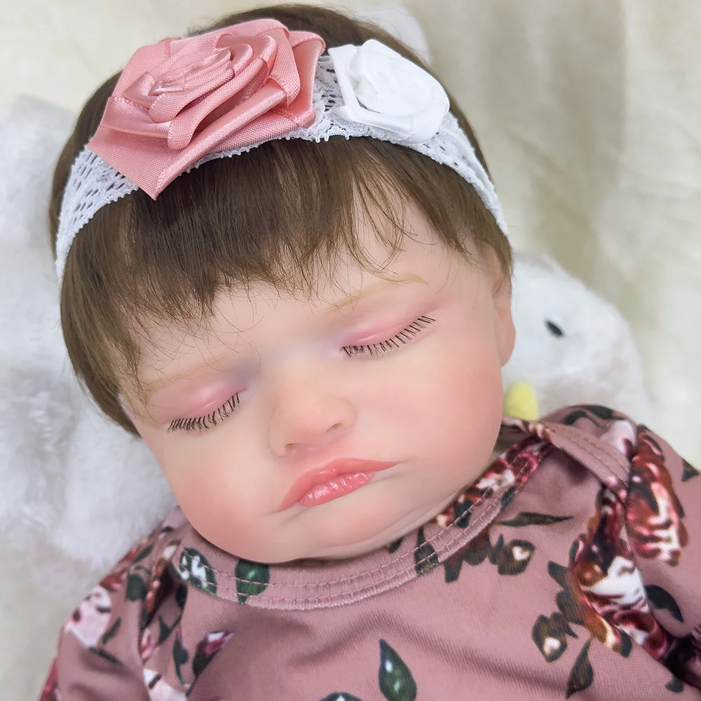 

18 inch vinyl reborn doll with soft cloth body, dressed in floral print outfit, sleeping state design, hand rooted hair,