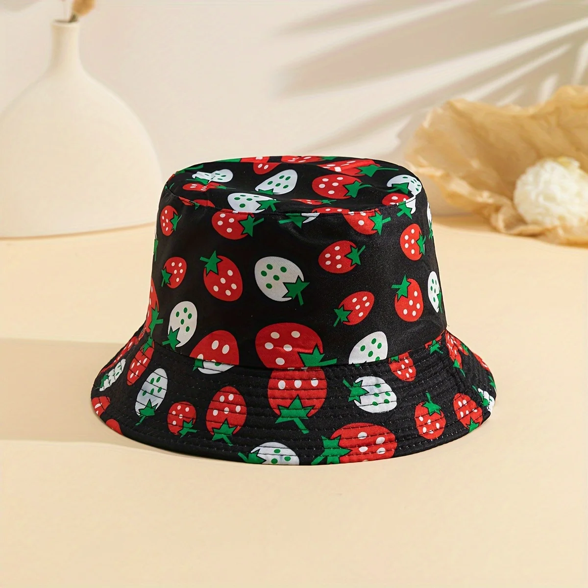 A Single Pack of a Fisherman Hat with Strawberry And Graffiti Designs a Stylish Fishing Hat Suitable for Both Men And Women